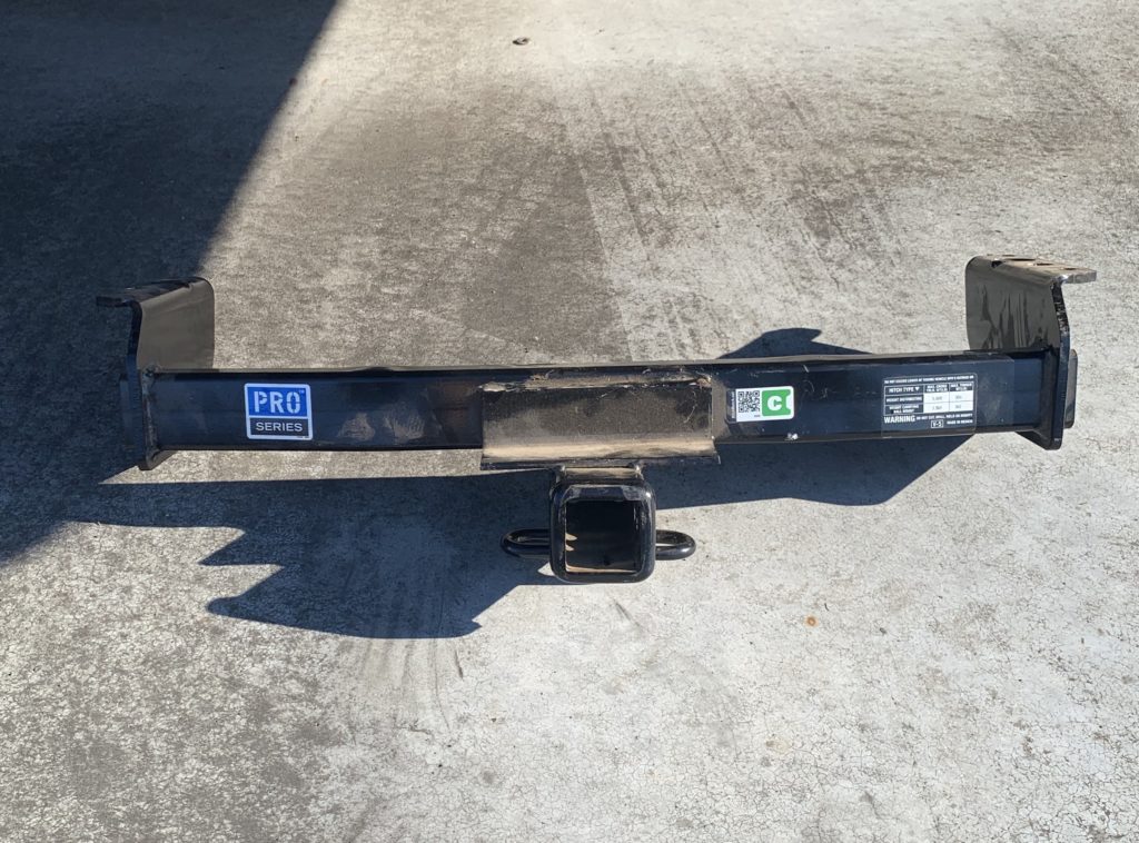 31 inch Trailer Hitch Receiver on the parking pad just behind my bus