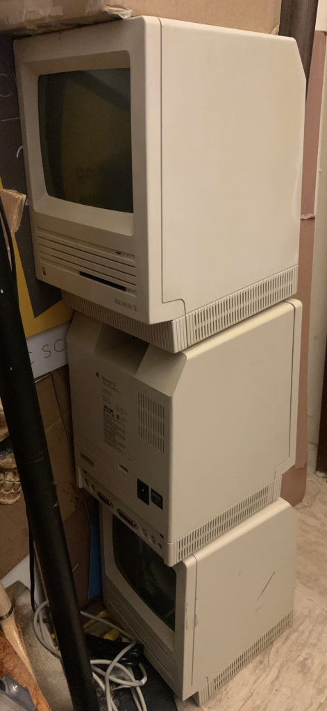 One stack of vintage Macintosh SE Computers, waiting to be cleaned